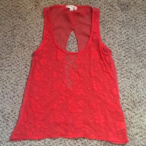 Orange floral see through tank top with back slit.